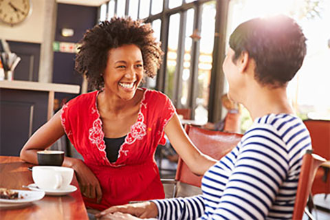 Women Chatting and Smiling